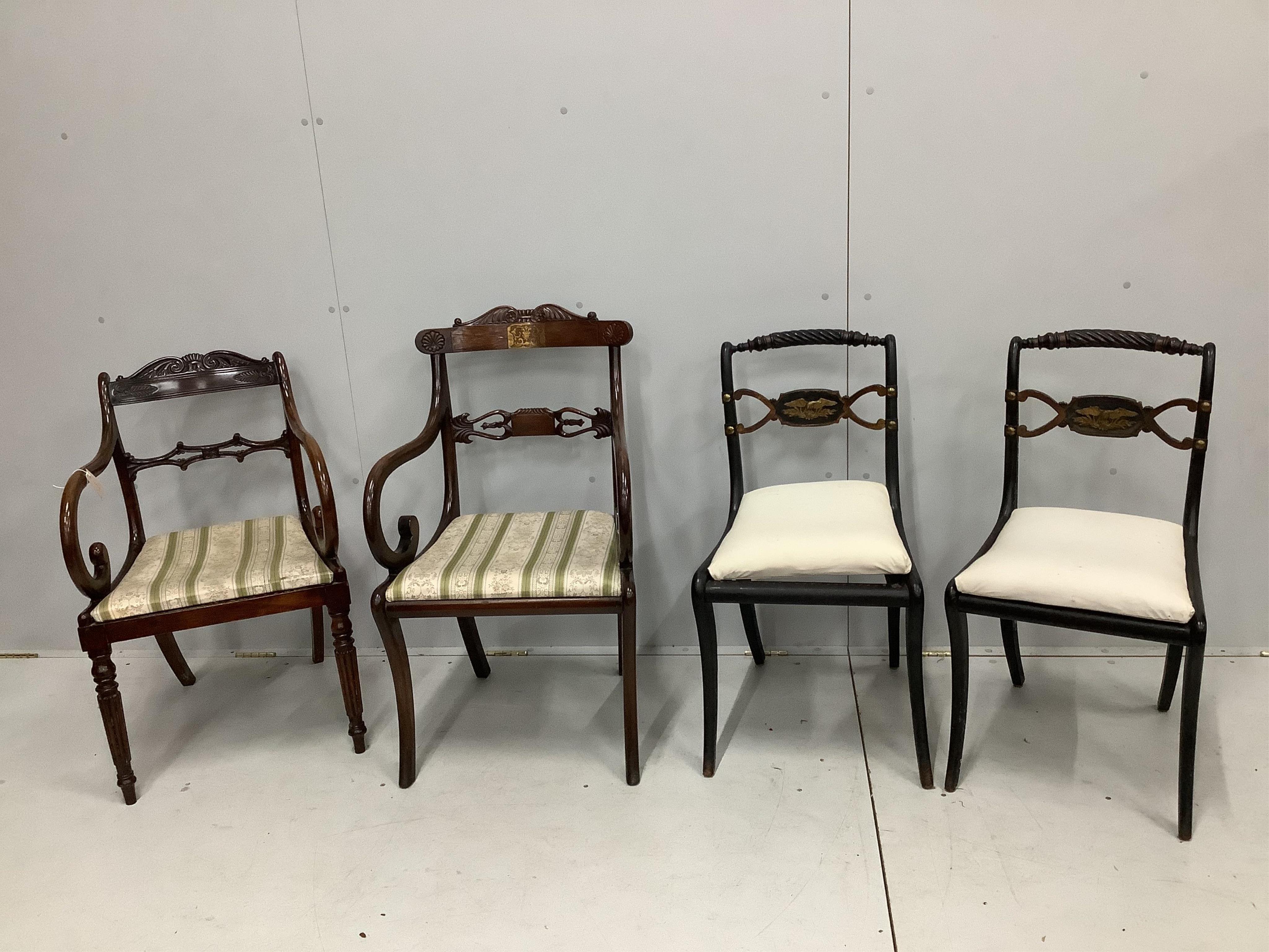 Two Regency mahogany and rosewood elbow chairs together with two Regency ebonised dining chairs. Condition - fair